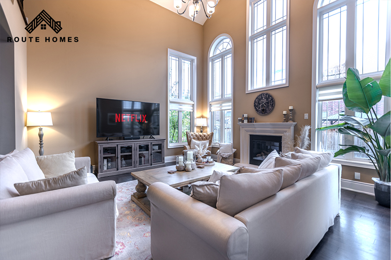 Luxury home renovation in Toronto featuring modern open-concept living room and high-end finishes by Route Homes.